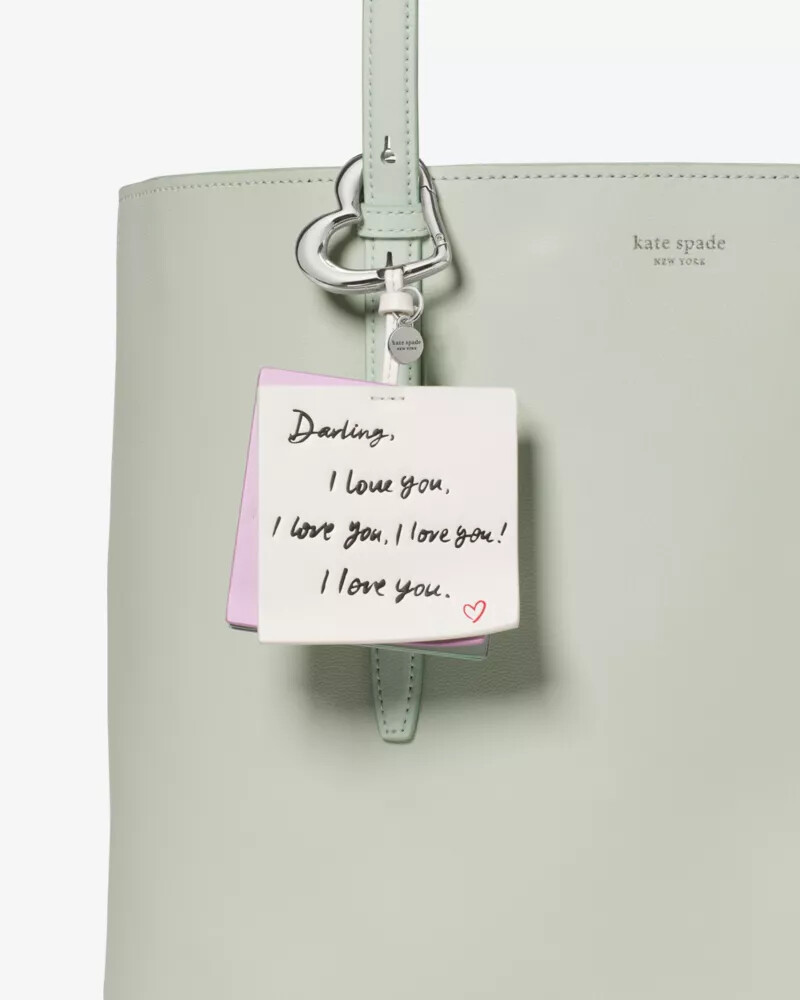 charmed love notes bag charm cream multi