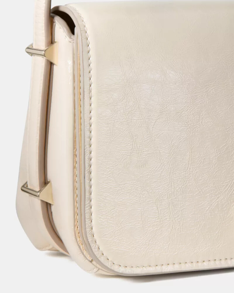 liv crinkle patent crossbody bag cashew milk